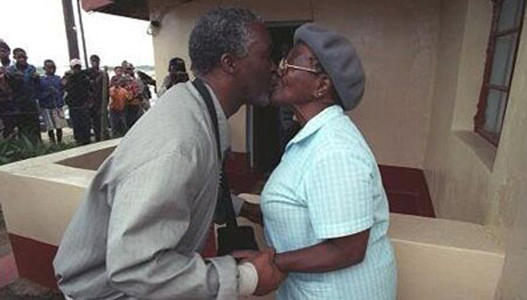 Thabo Mbeki greeting his mother with a kiss