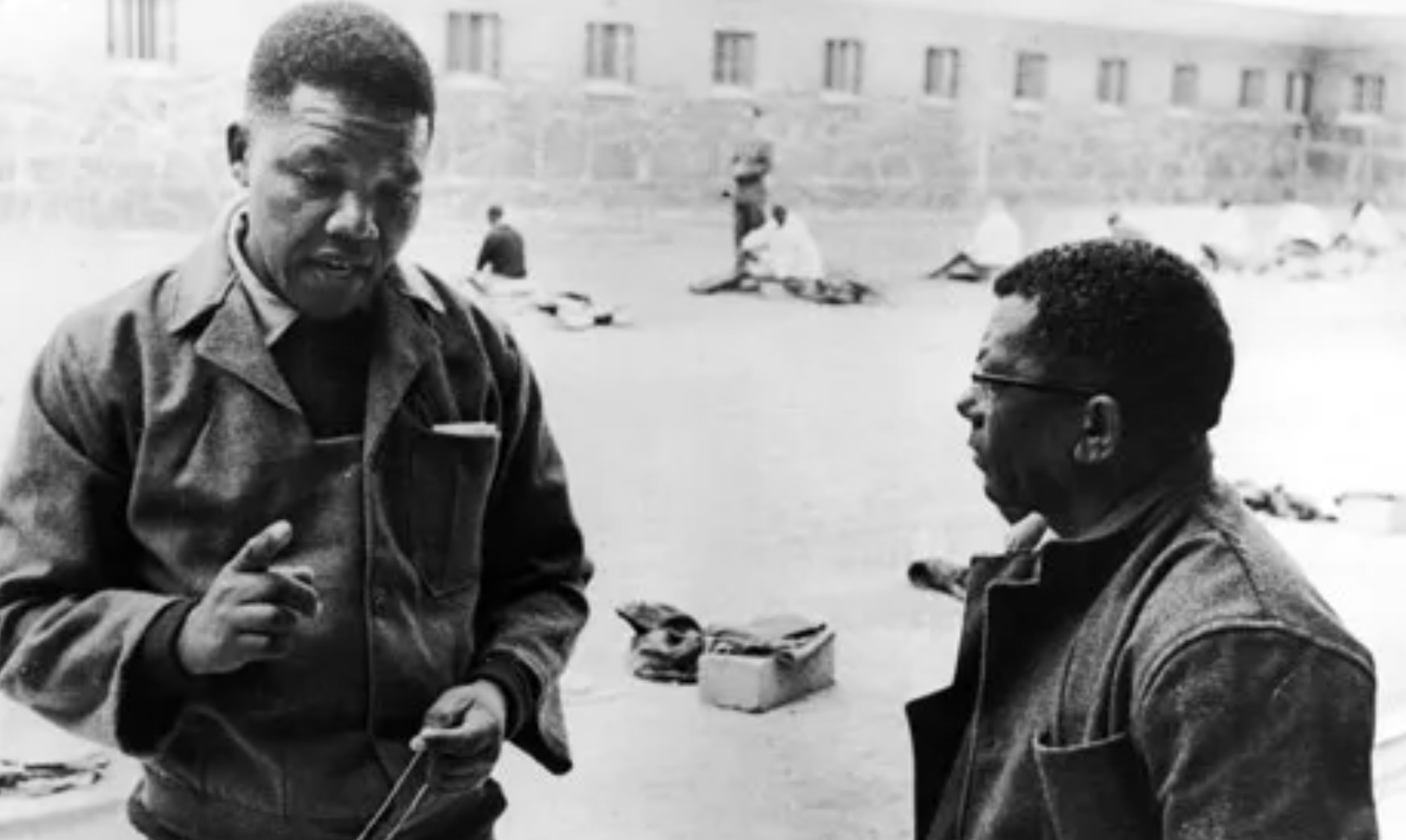 Nelson Mandela and Walter Sisulu chat while working in the Robben Island Prison courtyard. Source: STE Publishers