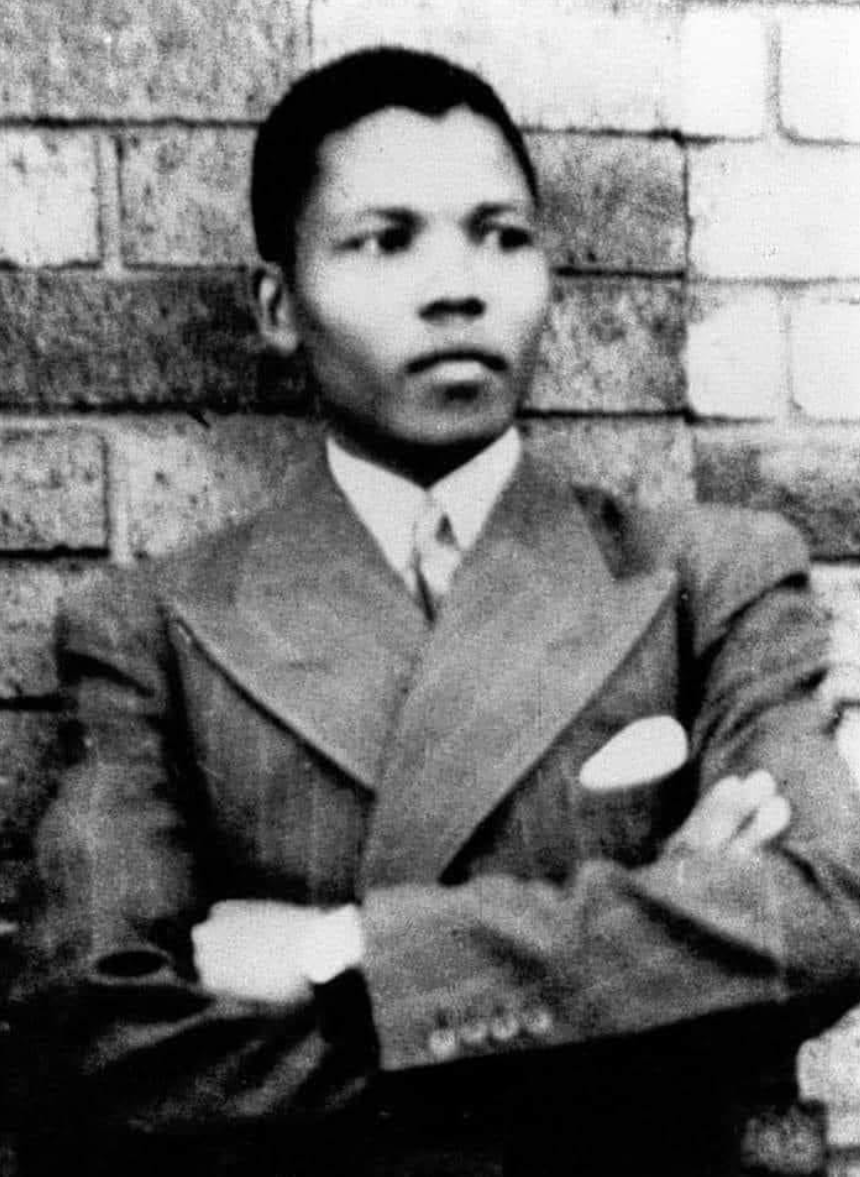 Mandela in Umtata, in his first suit, presented to him by the Paramount Chief of the abaThembu, Jongintaba Dalindyebo. © Mayibuye Centre.