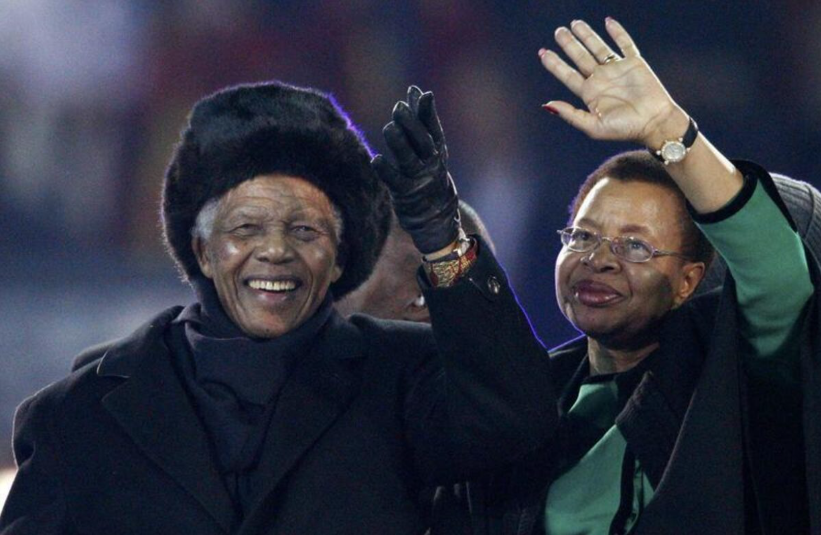 President Mandela and his wife Grace Machel wave to people during the closing ceremony of the 2010 World Cup at Soccer City stadium in Johannesburg, Photographer: Michael Kooren, Image Source