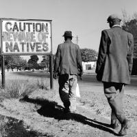 Warning sign at the entry of an area for "natives" Ejor/Getty Images 