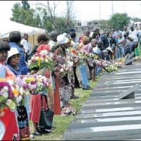 Families lay wreaths during the 25th anniversary of the Sebokeng Massacre where 39 people were killed while attending an all-night vigil 