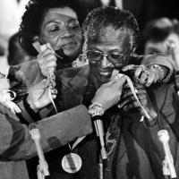 Tutu receives the Martin Luther King Jr. Award for Non-Violence while visiting Atlanta in January 1986. At left is King's wife, Coretta Scott King. King's daughter Christine is behind Tutu, and Tutu's daughter Naomi is at right. AFP/AFP/Getty Images