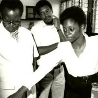 Oliver Tambo with students in a science lesson 
